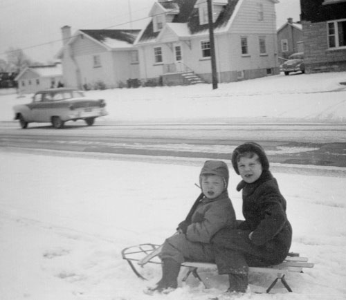 John Wordsworth and sister Hazel on sled in 1956