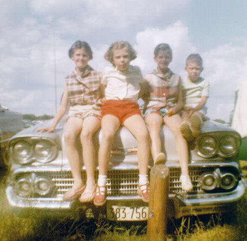 John and Hazel Wordsworth on a car in the 60s