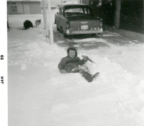 John Wordsworth 5 years old playing in snow at first house