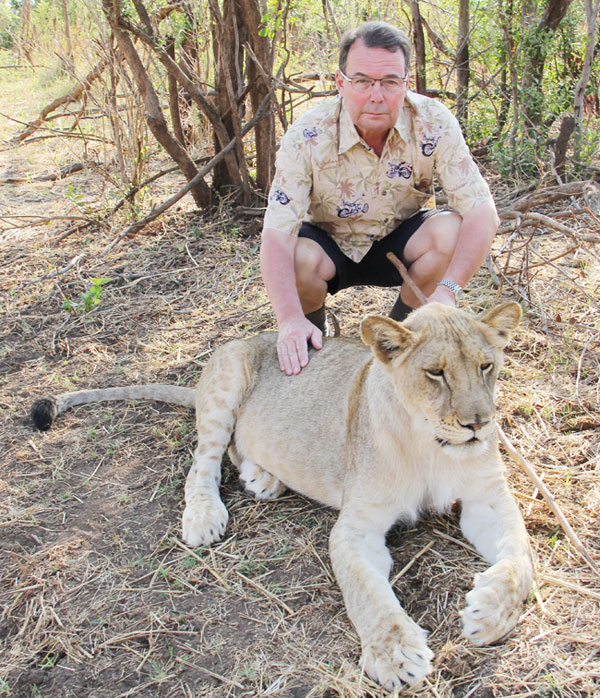 John Wordsworth petting Lion in South Africa