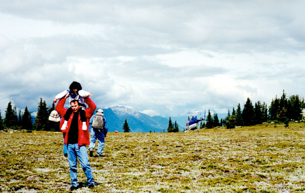 Purcell mountain helicopter fly in John Wordworth with Jess on shoulders