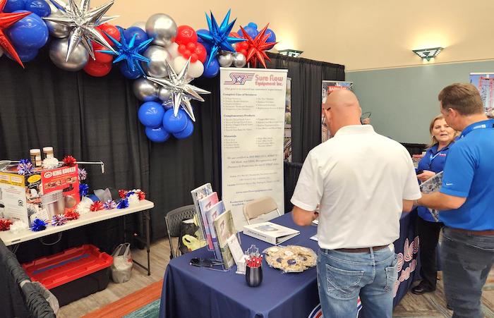 Visitors at the Sure Flow Equipment booth at the Texas City Trade Show